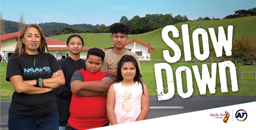 Umupuia Marae, Maraetai billboard showing family urging people to slowdown