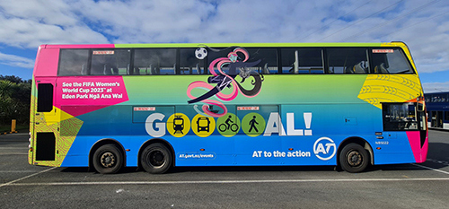Image of one of Auckland Transport double decker buses with AT wāhine artwork across it and GOAL. Auckland Transport to the action. 