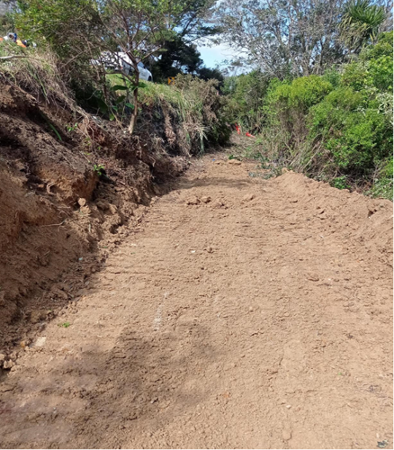 A dirt access track leads to the newly established work area.